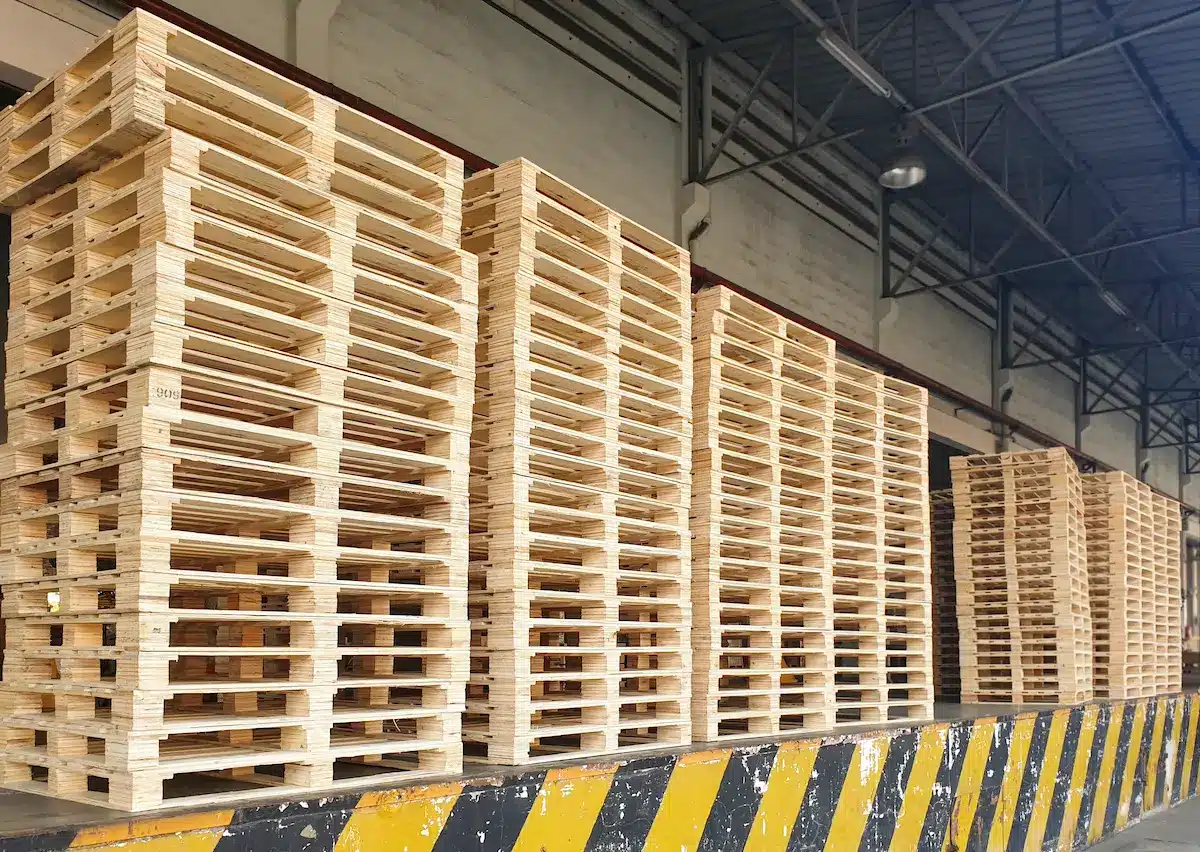 a big pile of wooden pallet on the loading dock