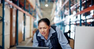 warehouse worker working on a computer