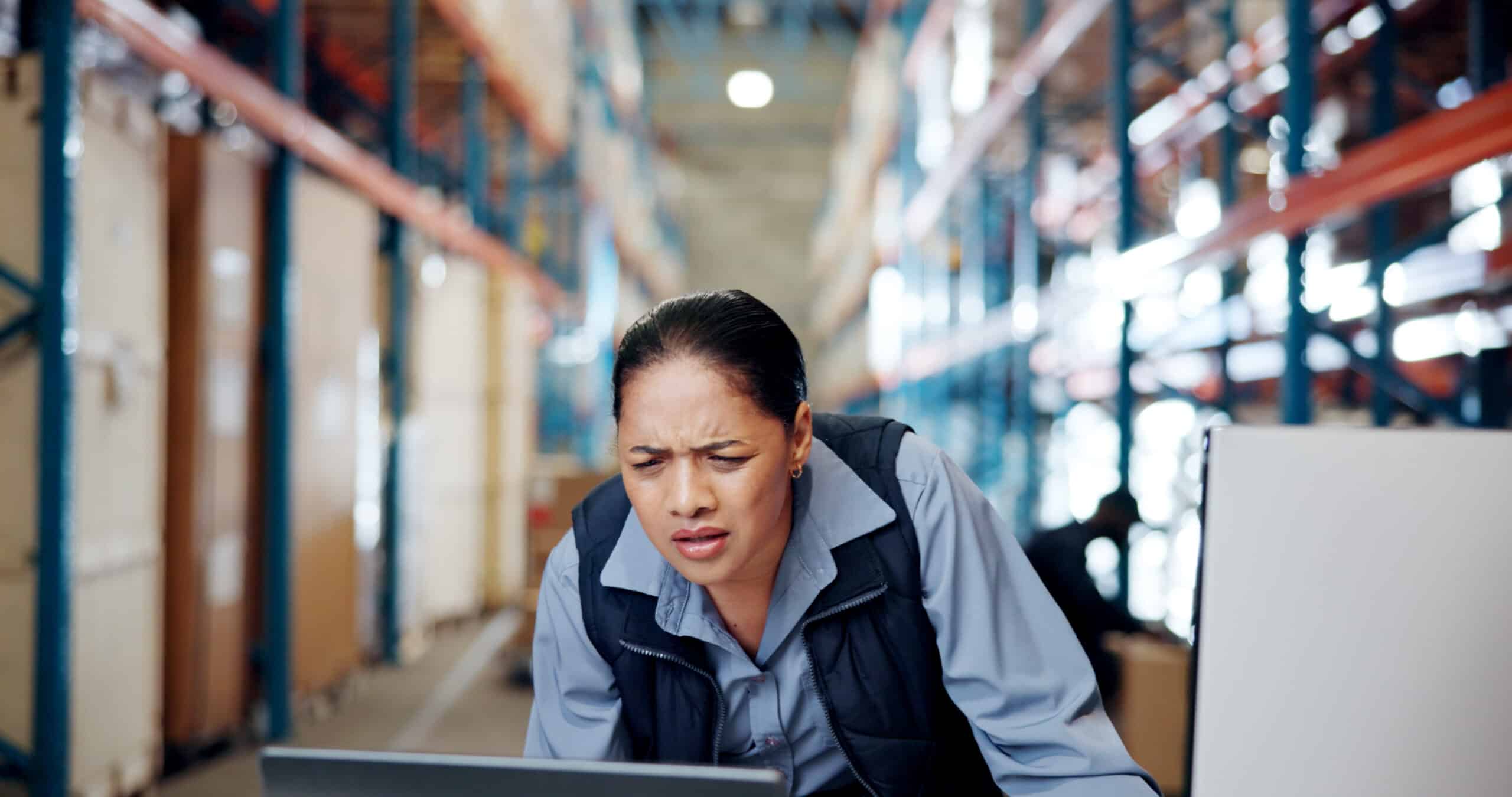 warehouse worker working on a computer