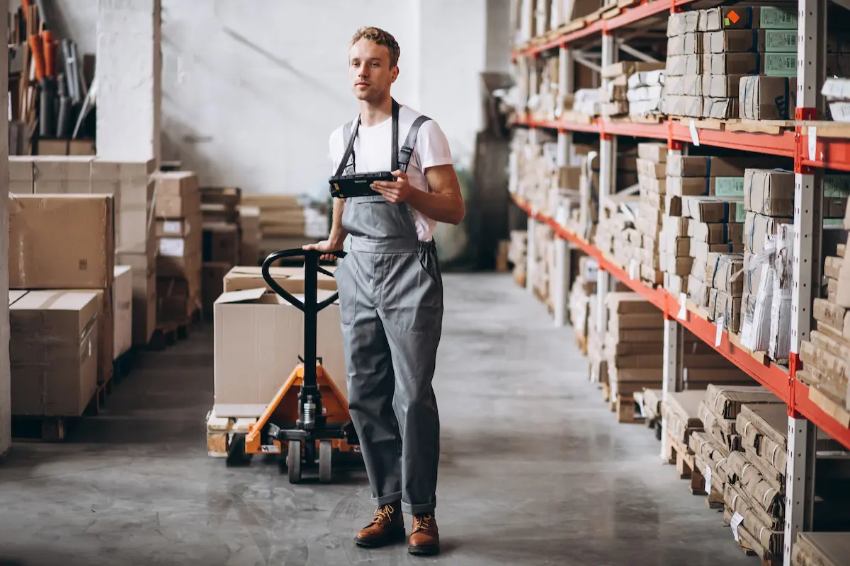 young-man-working-warehouse-with-boxes